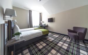 Postel nebo postele na pokoji v ubytování Hotel Impresja