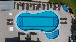 an overhead view of a swimming pool at Amarylis Beachfront Studios in Amoudi