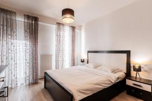 Posteľ alebo postele v izbe v ubytovaní Garden Towers