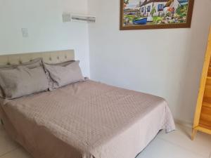 Postel nebo postele na pokoji v ubytování Pousada das Orquideas