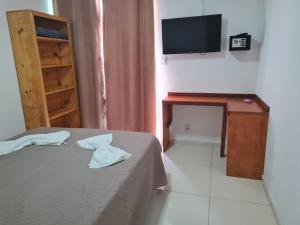 Postel nebo postele na pokoji v ubytování Pousada das Orquideas