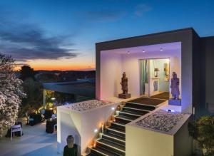 a villa with a view of the sunset at Monvidal Residence - Adults Only in Pula