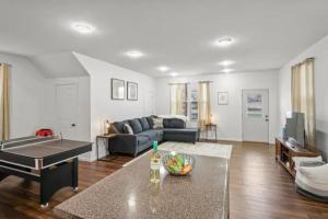 a living room with a couch and a table at Multiple homes side by side downtown in Indianapolis