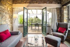 a living room with a couch and chairs and a table at Casa Gianfranco - ACrapa Mangia in Santa Maria di Castellabate +5 photos