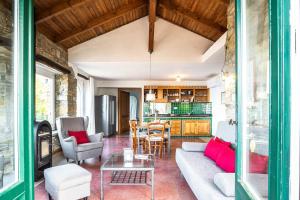 a living room with a couch and a table at Casa Gianfranco - ACrapa Mangia in Santa Maria di Castellabate