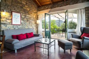 a living room with a couch and a table at Casa Gianfranco - ACrapa Mangia in Santa Maria di Castellabate