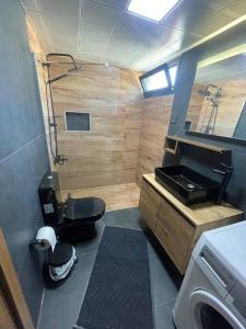 a small bathroom with a toilet and a sink at Merkezde denize 5 dakika villa in Kusadası