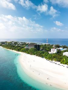 an aerial view of a beach with people on it at Ukulhas Sands in Ukulhas