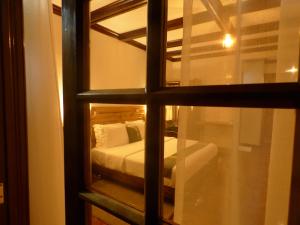 a view of a bedroom through a window at Le Pristine Wellness and Healing Hotel in Nyeri