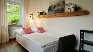 Postel nebo postele na pokoji v ubytování Schwarzwaldraum Schlossblick