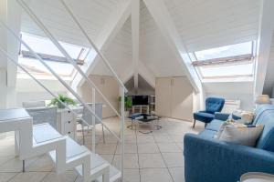 an attic living room with skylights at Politecnico & Crocetta Elegant Flat in Turin