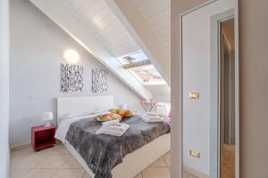 a bedroom with a bed in a attic at Politecnico & Crocetta Elegant Flat in Turin
