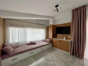 a bedroom with a large bed with a large window at Milena's Luxury Villa in Iraklitsa +33 photos