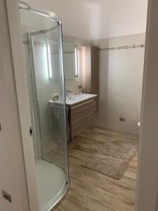 a bathroom with a shower and a sink at Casa Lina Tirano in Tirano