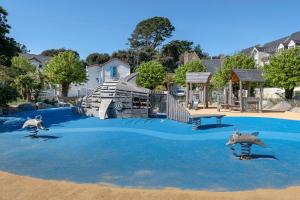 a painting of a playground with a slide and dolphins at 500m Plage des Libraires - Maison 4 chambres in Pornichet