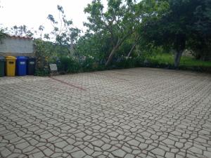 a brick driveway with a red cord on it at KATY&MLADEN in Baška