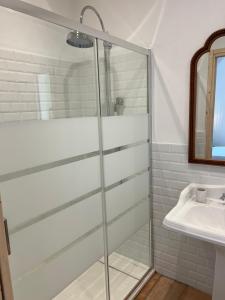 a bathroom with a shower and a sink at Maison d'Orange - La Pinede in Saint-Tropez