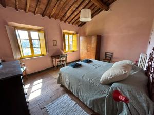 Posteľ alebo postele v izbe v ubytovaní La Casina dei Frati