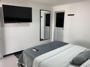Televiisor ja/või meelelahutuskeskus majutusasutuses Malokas Resort - Socorro - San Gil