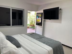 Televiisor ja/või meelelahutuskeskus majutusasutuses Malokas Resort - Socorro - San Gil