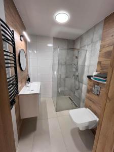 Ванная комната в Wczasy Chmielno Apartament Turkusowy