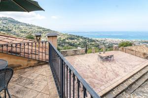 a balcony with a table and a view of the ocean at Sparviero - ACrapa Mangia in Santa Maria di Castellabate +3 photos
