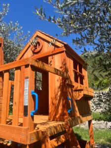 a wooden play house sitting on top of a bench at Apartments HAS in Kotor