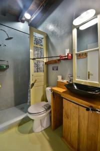 a bathroom with a toilet and a sink at Mastoris Mansion in Hydra