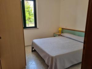 Postel nebo postele na pokoji v ubytování Villaggio Camping Lungomare