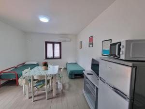Kuchyň nebo kuchyňský kout v ubytování Villaggio Camping Lungomare