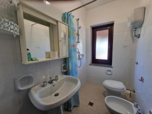Koupelna v ubytování Villaggio Camping Lungomare