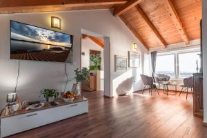 a living room with a large flat screen tv on a wall at Villa Old Town in Šibenik