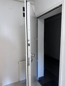 an open door to a hallway in a room at Apartman Pionirska dolina in Sarajevo