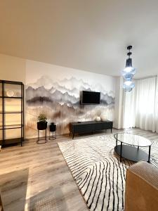 a living room with a wall mural of mountains at VP Suites in Budapest