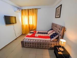 Ένα ή περισσότερα κρεβάτια σε δωμάτιο στο TMC Luxury Home