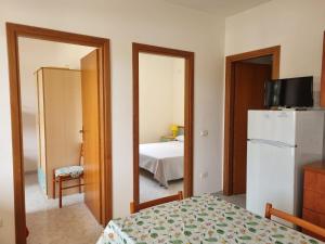 Postel nebo postele na pokoji v ubytování Villaggio Camping Lungomare