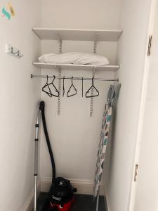 a walk in closet with a ladder and a helmet at Milton Road Flat 2 - TSAC in Hartlepool