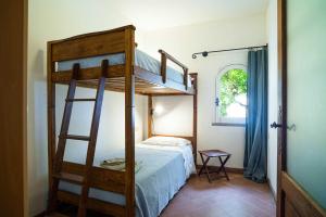 Ένα ή περισσότερα κρεβάτια σε δωμάτιο στο L Arco - ACrapa Mania