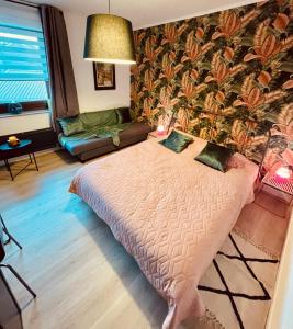 a bedroom with a bed in a room with a wallpaper at MARINY in Spa +18 photos