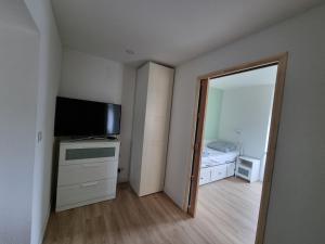 Postel nebo postele na pokoji v ubytování Le Tournesol, Appartement T1 bis