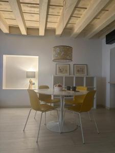 a dining room with a table and chairs at SanPietro in Verona