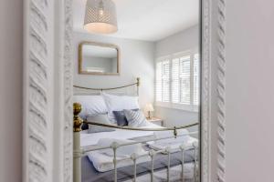 Un pat sau paturi într-o cameră la Hillcrest Cottage