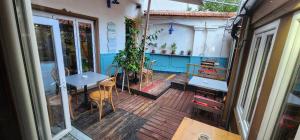 a balcony with a table and chairs on a deck at Hotel London in Tirana