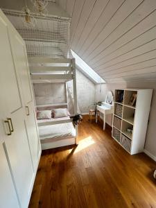 a bedroom with a bunk bed in a attic at VILLA KATARINA with heated pool in Liptovský Mikuláš +38 photos