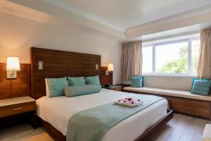 Postel nebo postele na pokoji v ubytování BodyHoliday St Lucia