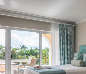 Postel nebo postele na pokoji v ubytování BodyHoliday St Lucia
