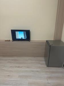 a flat screen tv sitting on top of a table at Zvartnoc House in Ejmiatsin