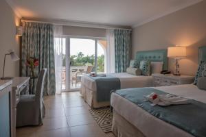 Postel nebo postele na pokoji v ubytování BodyHoliday St Lucia