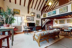 a living room with a couch and a tv at Great Ledges Studio in Rockport