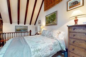a bedroom with a bed and a dresser at Great Ledges Studio in Rockport
